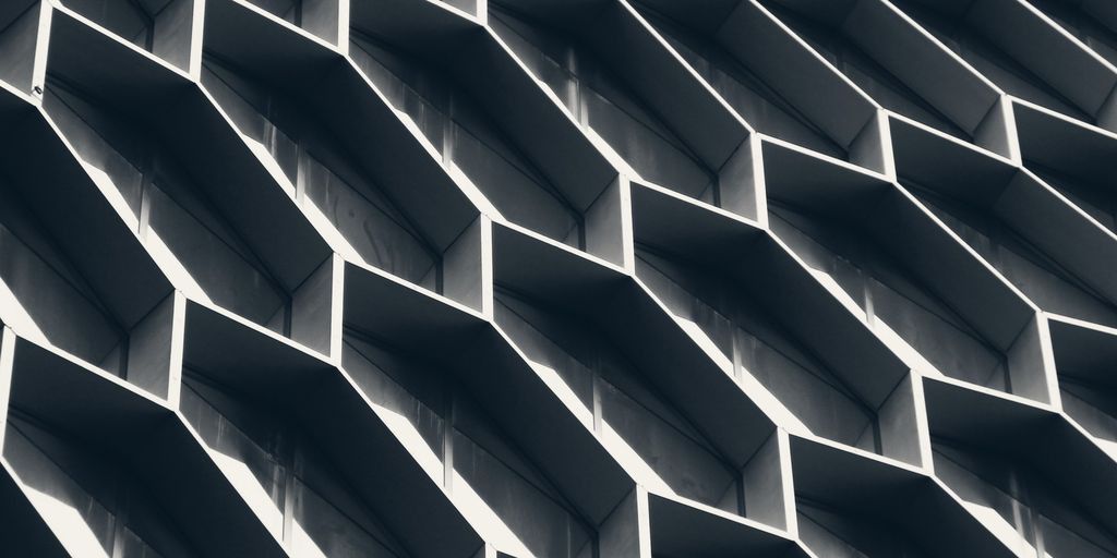 A building facade built from a repeating grid of hexagonal frames